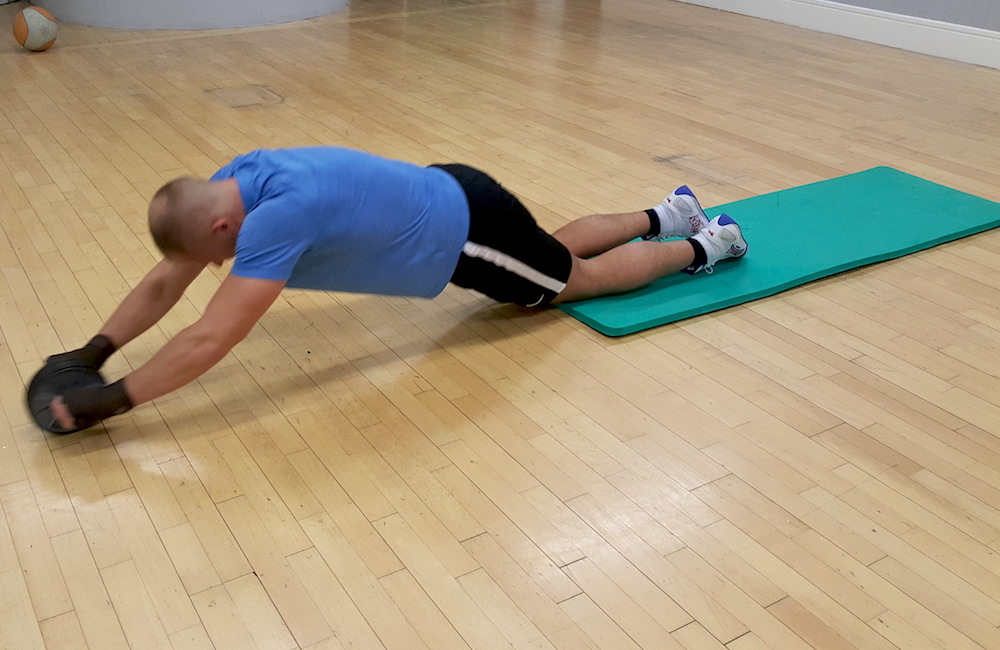 one of robs  personal training students excercises with a roller