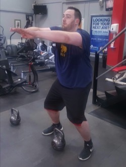 One of Robs students does an excercise routine on robs fitness personal training programme at Richmond Olympus Gym