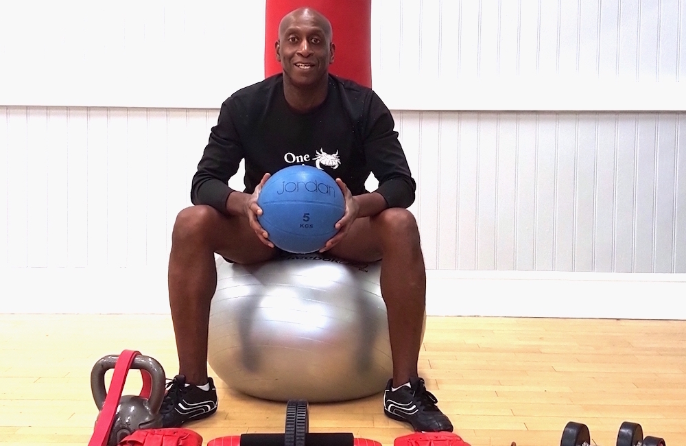 Rob poses with training equipment at the Richmond Olympus Gym