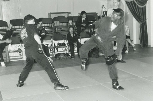another original image of a young Rob Lloyd just about to perform a side kick